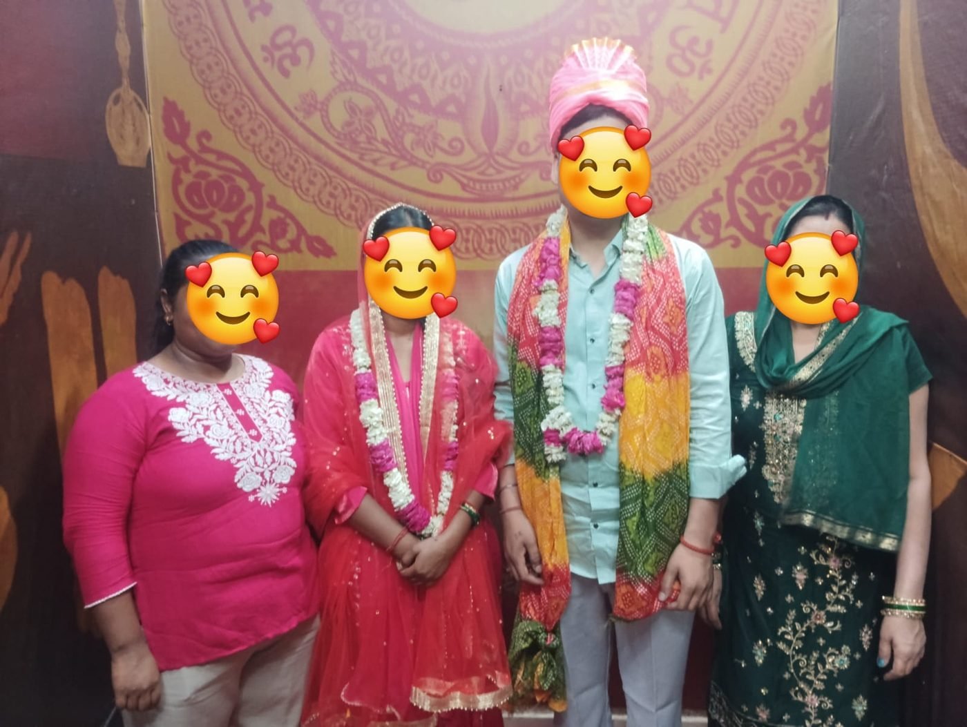 Arya Samaj Mandir Delhi family wedding — bride, groom with mother and witnesses in front of Om backdrop